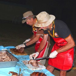 Keith & Peter - Slicing the Spit Roast