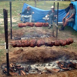 Turist with his spit roasts
