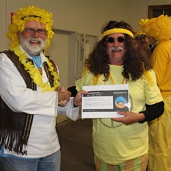 Mick Presents Capt Norty with a voucher for a BOG Wheel Cover Won at Auction