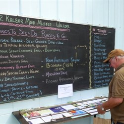 Ken (Kenmarg) scanning the Things To Do Board