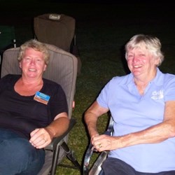 Sheryl (Bonnidowns) and Jenny (Umpire83) share a quiet moment at the campfire