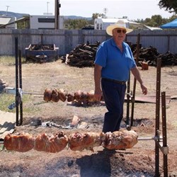 Bob Pollock looking after the spit roasts