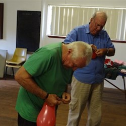 Trevor & Stephen playing a balloon game.