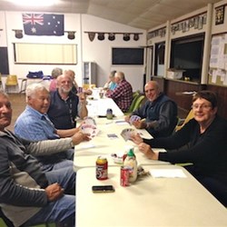 At the other end of the table they are playing phase 10, although it looks as though they are not to afraid to show their hands.