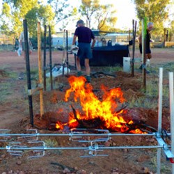 Stoking Up The Spit Roast