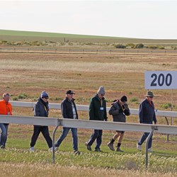 The early morning walkers passing the 200m post