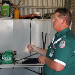 Ambo demonstating the defibrillator