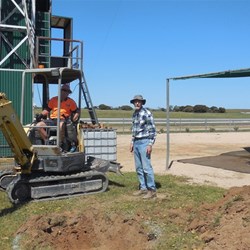 Tassie Pete instructing the digger where to dig for the Spit Roast Fire Pits