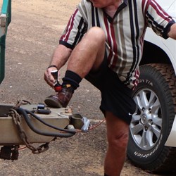 Trevor polishing his shoes before a day out.