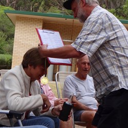 Brad giving Lyn her medal.
