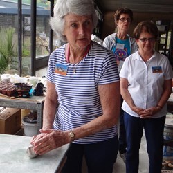 Thelma having a go at rolling the clay.
