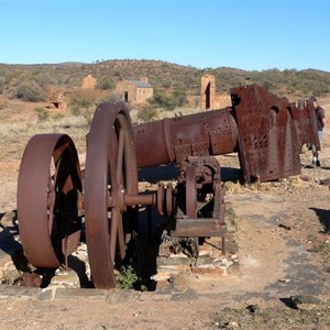 Old mining machinery and partially restored buildings at Arltunga