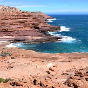 Red cliffs continue south