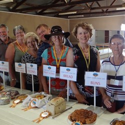 Smiling faces behind the winning camp oven delights.