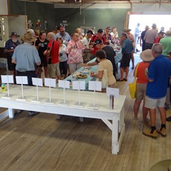 Sampling the delights of the Camp oven cook off.