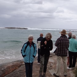 Watching the waves crashing onto the rocks.