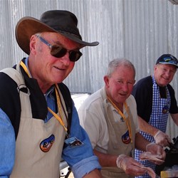 The crew cooking the sausages.