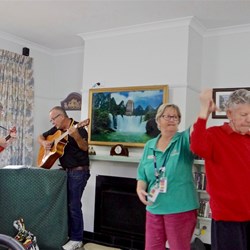 A very appreciative resident dancing to the music provided by our travelling duo.