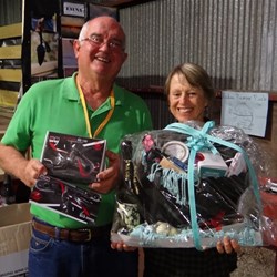 Greg & Sue looking happy with their raffle wins, pamper pack and the SIM dash cam