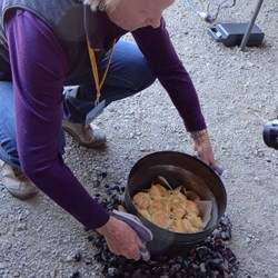 Scones cooked &  looking scrumptious, coming off the coals.