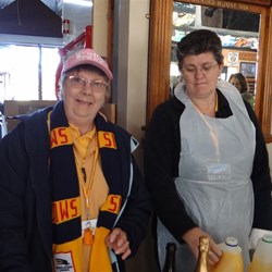 A couple of the helpers at the drinks counter.