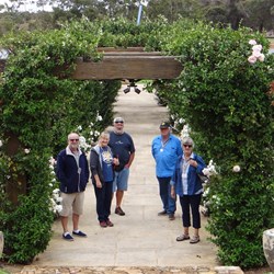 Enjoying a walk through a winery rose gardens.
