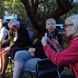 Enjoying a chat at evening drinks.