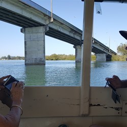Boat trip going under the singing  bridge