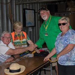 John & Petria collecting name badges 