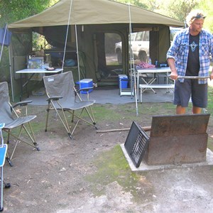 Trailer set up with awning and kitchen