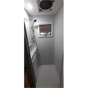 Shower with storage, skylight and fan