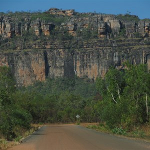 Tarred floodway and cliffs