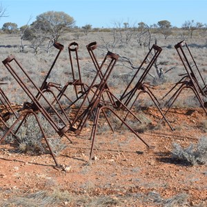 Old rusting smoke rocket launchers along Smokey Lane