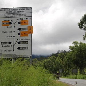 Road condition sign at the intersection