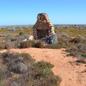 The old ruin is located right on the side of this track