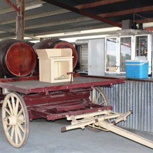 Barrels on an old wagon beside the bar in the function shed