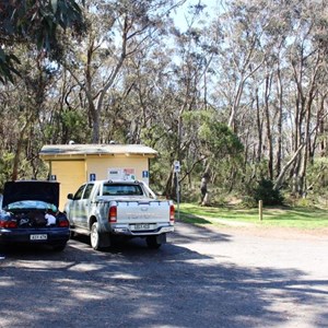 Toilet block and adequate parking with rubbish bins.