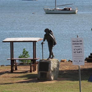 Queens steps behind miner statue