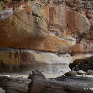 The art site is under the large ledge of this sandstone overhang