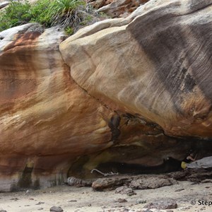 The art site is under the large ledge of this sandstone overhang