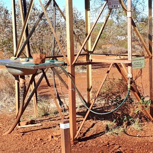 Water tank with washing basin and hose for refilling water tanks