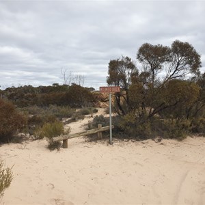 Milmed Rock sign and rock in background