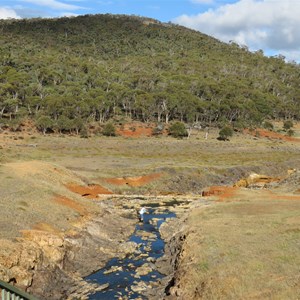 Tunnel spoil above orange soil