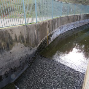 Empty flume and yellow staff gauge