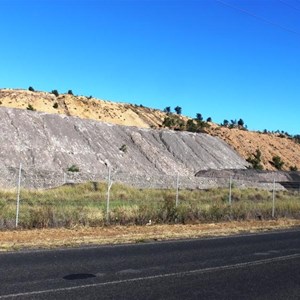 Overburden piled beside the highway.