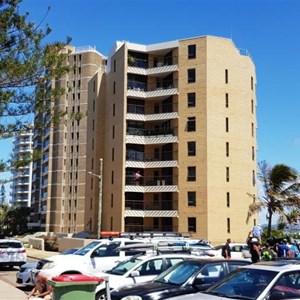 High rise apartment blocks overlook the car park