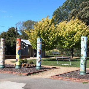 Painted poles at a public park.