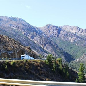 A caravan slowly climbing the Lyell Highway out of Queenstown
