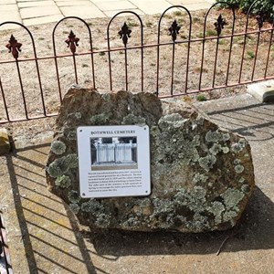 A plaque in the cemetery beside the church