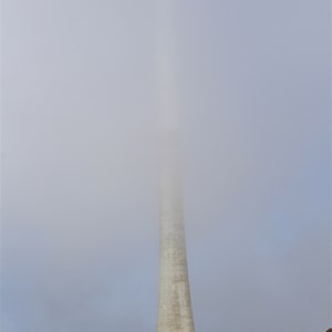 The tower at the summit partly obscured by cloud